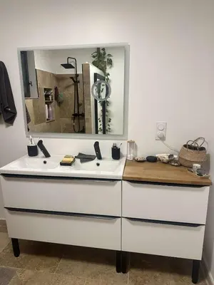 a bathroom with a white sink and a mirror at charmante petite maison - piscine hors sol - proche Avignon in Avignon