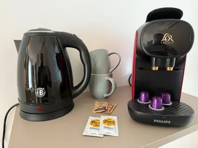 affeepot and a coffee maker on a counter at Le Clos d'Aix Célony studio 9 parking in Aix-en-Provence