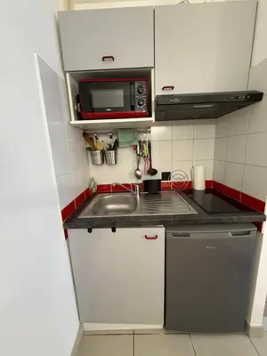 a small kitchen with a sink and a microwave at Le Clos d'Aix Célony studio 9 parking in Aix-en-Provence