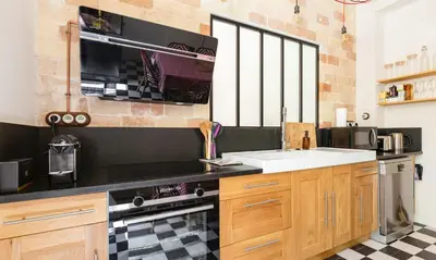a kitchen with a sink and a stove at House By The Sorgue River With Private Access in Fontaine-de-Vaucluse