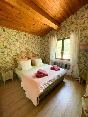 a bedroom with a bed and a wooden ceiling at Peaceful Retreat In The Heart Of Luberon in Roussillon