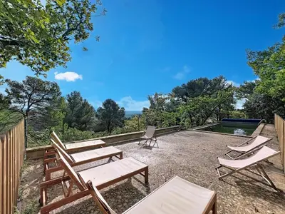 a group of chairs and tables and a pool at Grande maison de famille rénovée, vue sur Sainte Victoire in Venelles