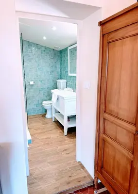 a bathroom with a tub and a toilet and a sink at Les Terrasses de Ventabren in Ventabren