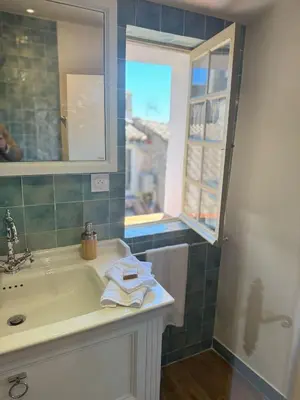 a bathroom with a sink and a window at Les Terrasses de Ventabren in Ventabren