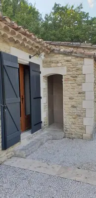 an entrance to a stone building with an open door at Air-conditioned Stylish Provence Villa in Oppède
