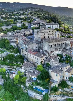 an aerial view of a village with buildings at Character House In The Heart Of Gordes in Gordes