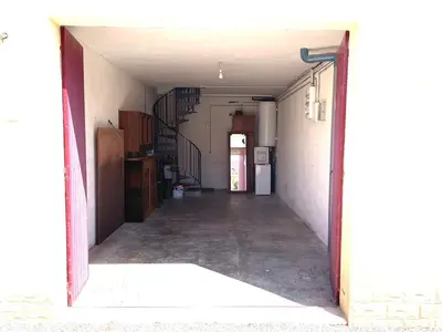 an empty hallway with a stairway in a house at Le Jardin d'Auguste in Roussillon