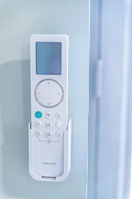 an electronic device is attached to a refrigerator at Studio raffiné - Aix hypercentre in Aix-en-Provence