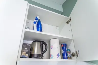 a cupboard with a coffee maker and other kitchen items at Studio raffiné - Aix hypercentre in Aix-en-Provence