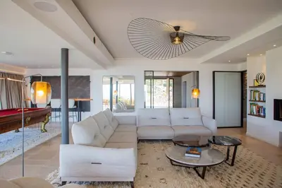 a living room with a couch and a table at Luxury 4-bedroom villa - pool in Gordes