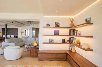 a living room with a couch and a table at Luxury 4-bedroom villa - pool in Gordes