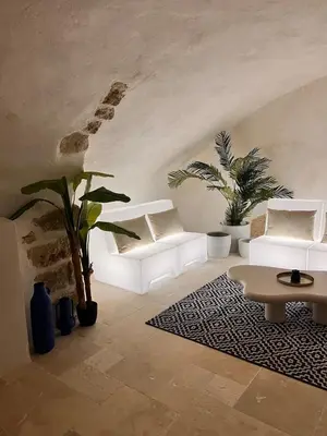 a bedroom with a mirror and two lamps on a table at Les Caves d 'Oía in Aix-en-Provence