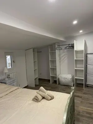 a bedroom with a bed with two towels on it at Maison de charme in Apt