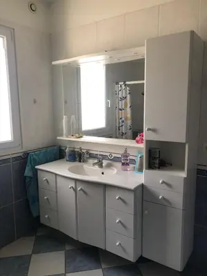 a white bathroom with a sink and a mirror at Jolie studio en Provence! in Pierrevert