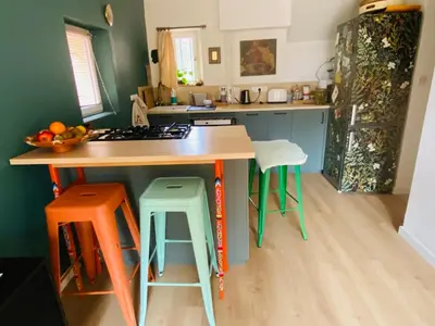 a kitchen with a island with a counter top at Le Mas St Pierre in Aix-en-Provence