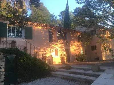 a white house with stairs in front of it at Le Mas St Pierre in Aix-en-Provence