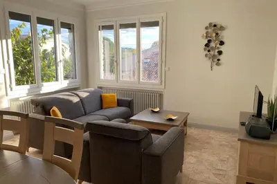 a living room with a couch and a table at La Maison de Gari spacious house with swimming pool and beautiful exterior in Les Taillades
