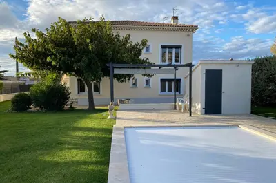 a house with a swimming pool in a yard at La Maison de Gari spacious house with swimming pool and beautiful exterior in Les Taillades