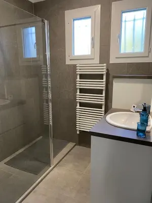 a bathroom with a shower and a sink at La Maison de Gari spacious house with swimming pool and beautiful exterior in Les Taillades