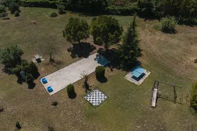 an overhead view of a backyard with a pool and trees at Domaine Manon en Luberon privatisé - 22 couchages in Lagnes