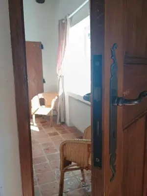 a door open to a living room with a window at Gîte Sorgue - Exceptionnel 125 m2 Piscine Parking Jardin in Saumane-de-Vaucluse
