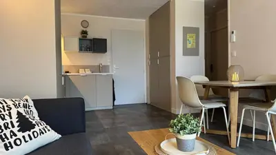 a living room with a couch and a table at Greens View golf saumane in Saumane-de-Vaucluse