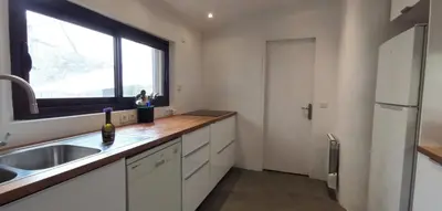 a kitchen with a sink and a window at 15 rue des pierres seches in Ferrassières