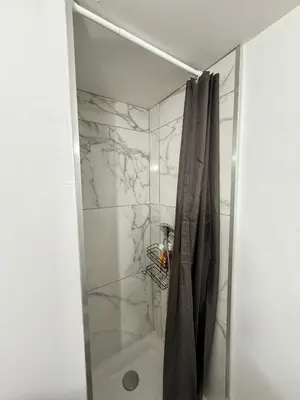 a bathroom with a shower with a shower curtain at Studio lumineux centre Aix en Provence in Aix-en-Provence