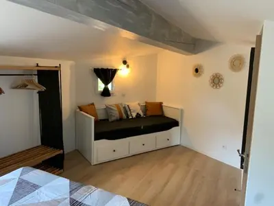 a bedroom with a bed in a room at Le petit bastidon gîte à Oppède avec piscine in Oppède