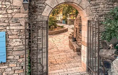 an entrance to a stone building with an archway at Awesome Home In Goult With Wifi in Goult