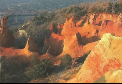 an aerial view of a rocky mountain with trees at Domaine au cœur du Colorado Provençal in Gignac