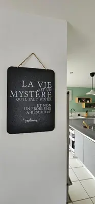a sign hanging on a wall in a kitchen at Manava in Cheval-Blanc