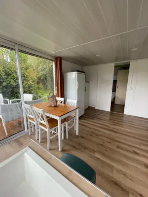 a kitchen and dining room with a table and chairs at Cottage with Natural Pool in LʼIsle-sur-la-Sorgue