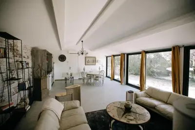 a living room with a couch and a table at The Aviary - Pernes-les-Fontaines in Pernes-les-Fontaines