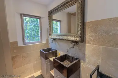 a bathroom with a sink and a mirror at Mas provençal au coeur de L'Isle-sur-la-Sorgue in LʼIsle-sur-la-Sorgue