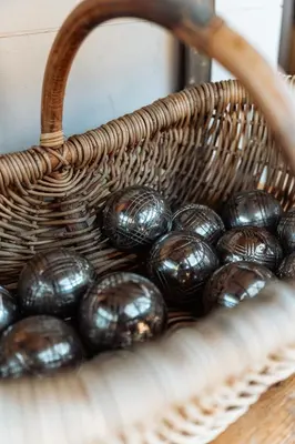 a basket filled with black eggs on a table at La Source Blanche in Gargas