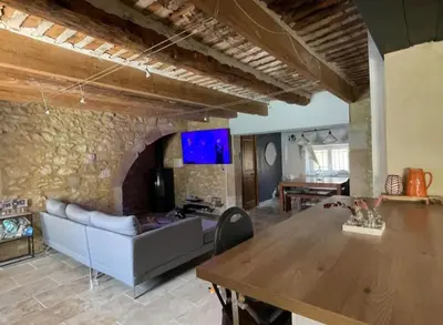 a living room with a couch and a table at Mas Bourbon in Cavaillon