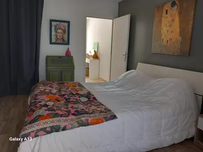 a bedroom with a bed with a quilt on it at villa zen en provence in Velleron