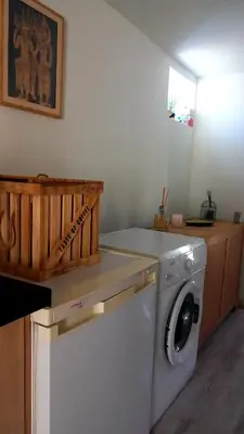 a washer and dryer in a room at Ty'ca house in Velleron