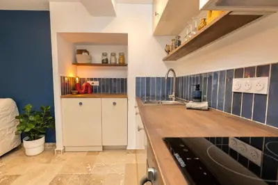 a kitchen with a sink and a counter top at Suite Bleu d'Azur - Hypercentre - Wifi in Apt
