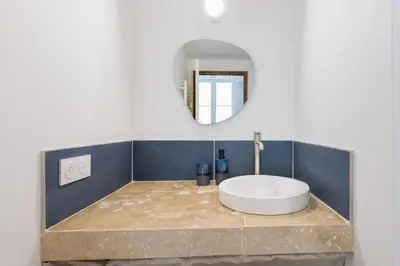 a bathroom with a large white tub on a counter at Suite Bleu d'Azur - Hypercentre - Wifi in Apt