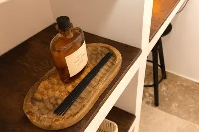 a bottle and chopsticks sitting on a table at Suite Bleu d'Azur - Hypercentre - Wifi in Apt