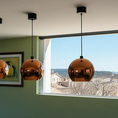 two lights are hanging in front of a window at Aix-en-Provence, Centre ville quartier Mazarin, magnifique loft in Aix-en-Provence