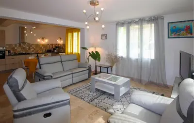 a living room with white couches and a table at Amazing Home In Lagnes in Lagnes