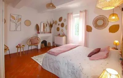 a bedroom with a bed and a table and a window at Amazing Home In Lagnes in Lagnes
