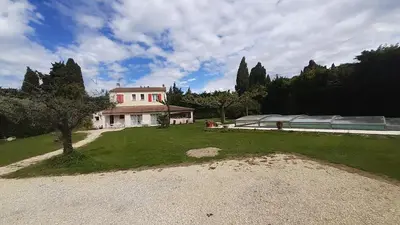 a large house with a greenhouse in a yard at 4 bedroom villa pool entire place in Salon-de-Provence