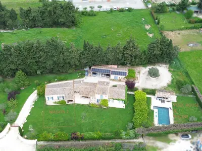 an aerial view of a house with a yard at Luboregard in Cheval-Blanc