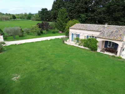 an aerial view of a house with a large yard at Luboregard in Cheval-Blanc
