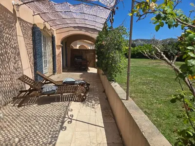 a couple of chairs sitting on a patio at Luboregard in Cheval-Blanc