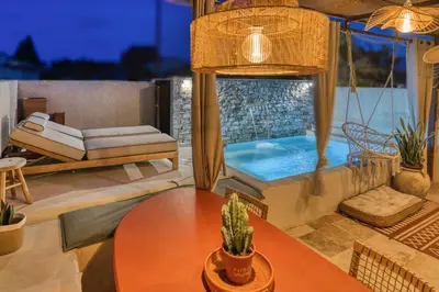 a villa with a swimming pool and a patio with a table at VILLA Isle sur la Sorgue in LʼIsle-sur-la-Sorgue